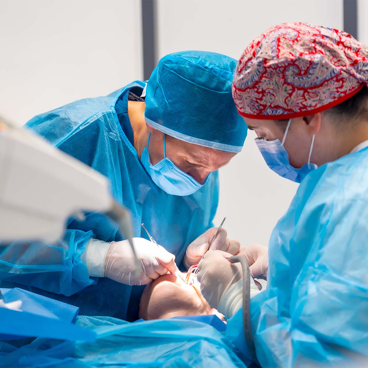 dentist and assistant working on patient