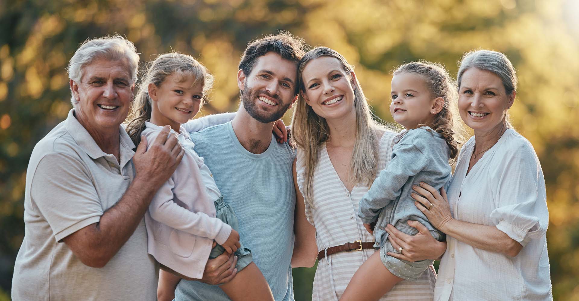 family portrait in a garden smiling